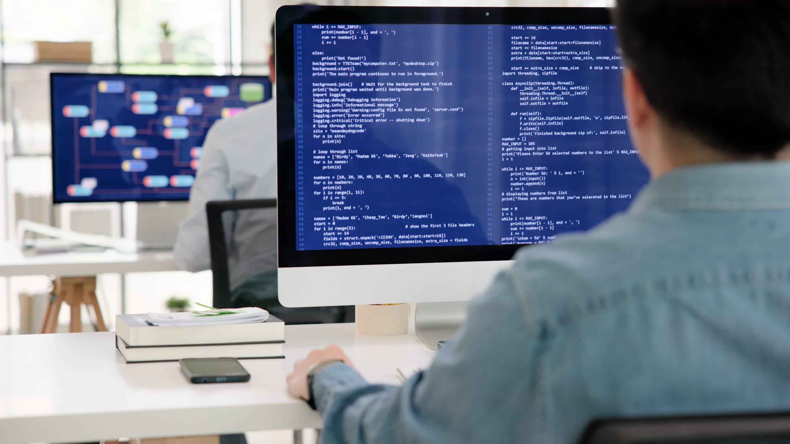 male on computer using AI to help with analytics and coding