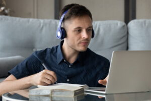 adult college student studying with laptop