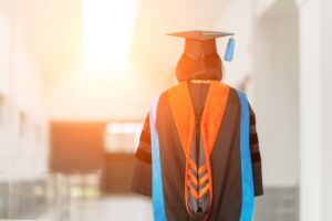 mba graduate in cap and gown