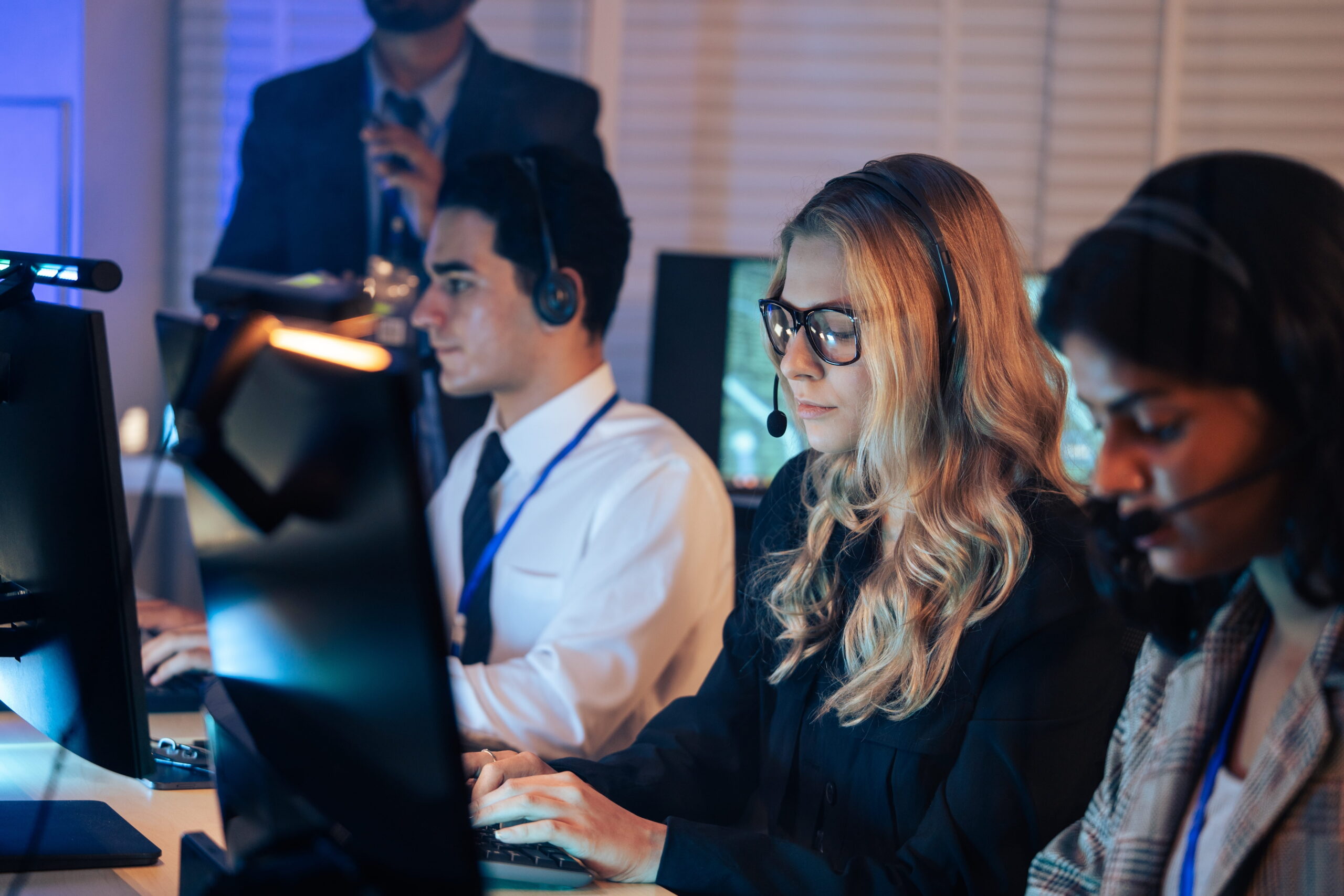 group of emergency managers on phone responding to crisis