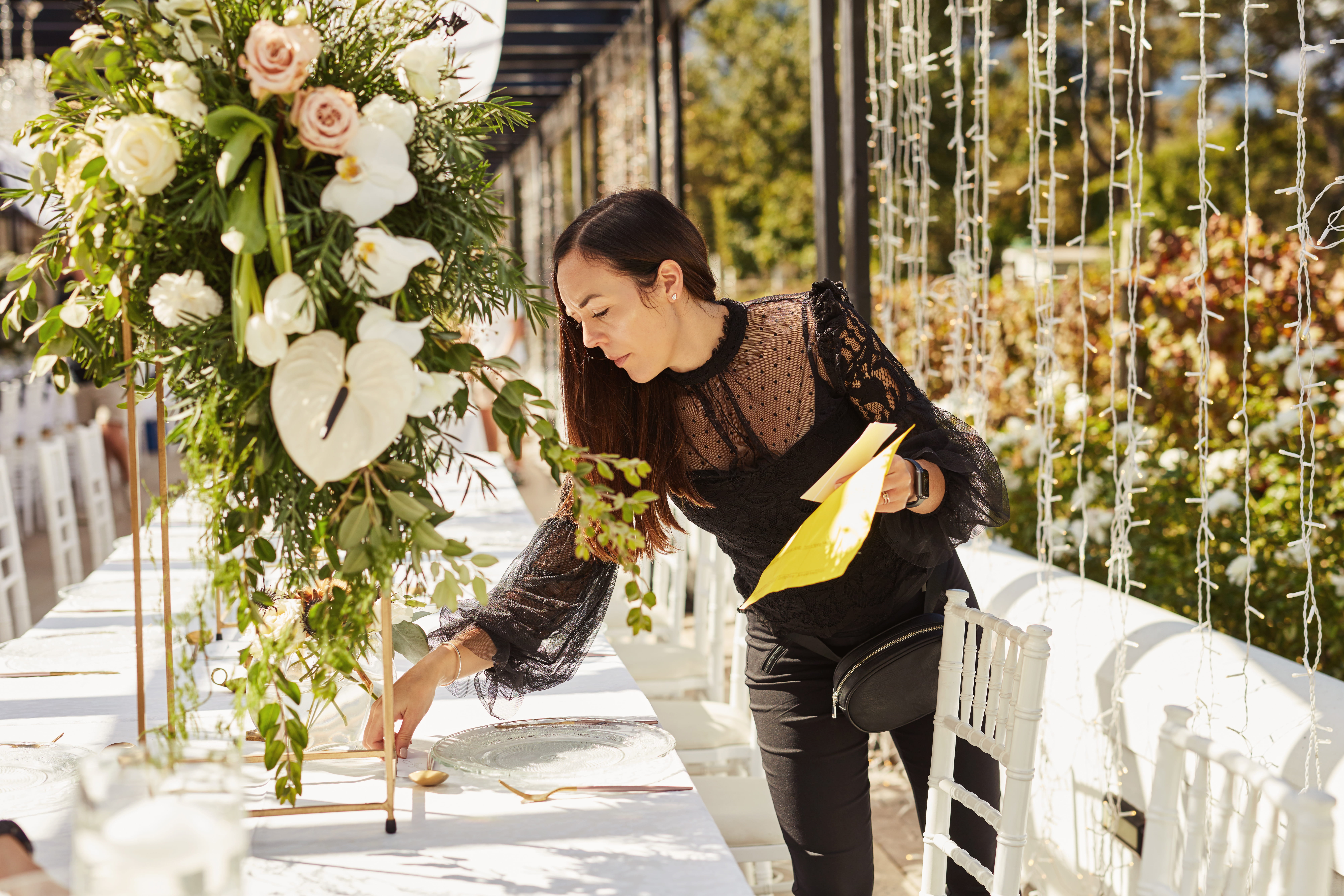 female event planner preparing venue for an event