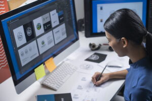 college student building a portfolio on computer